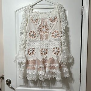 White off the shoulder belle sleeve intricate dress!
